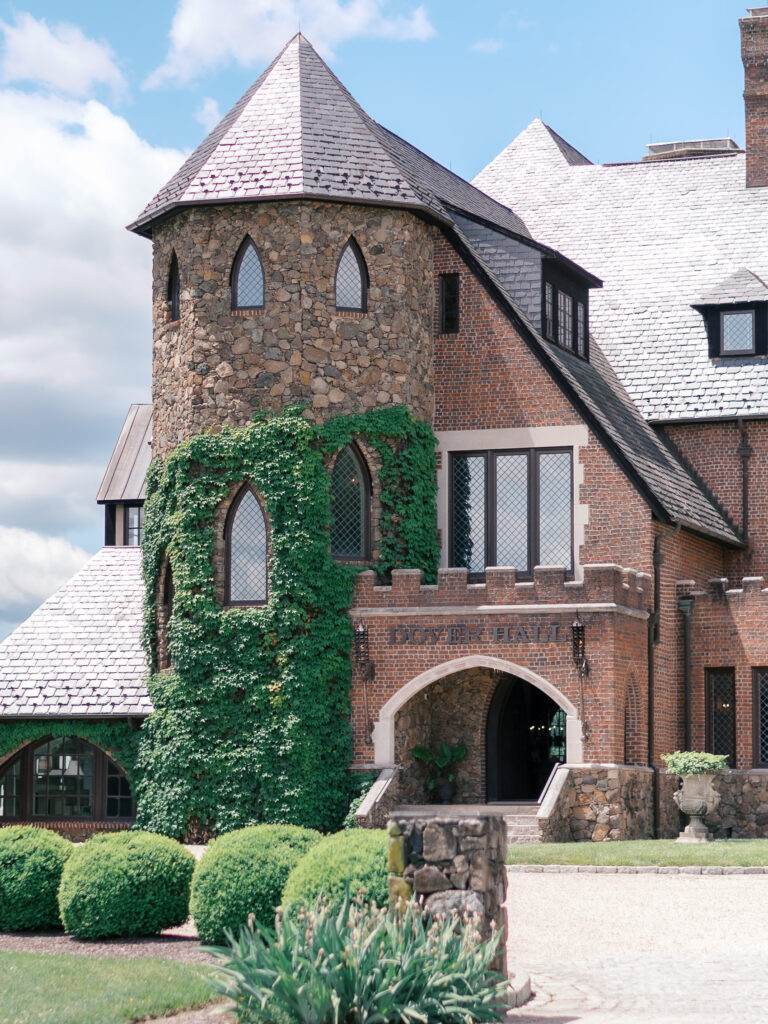 Daytime view of Dover Hall’s stone exterior and manicured grounds, a luxury wedding venue near Richmond, VA.