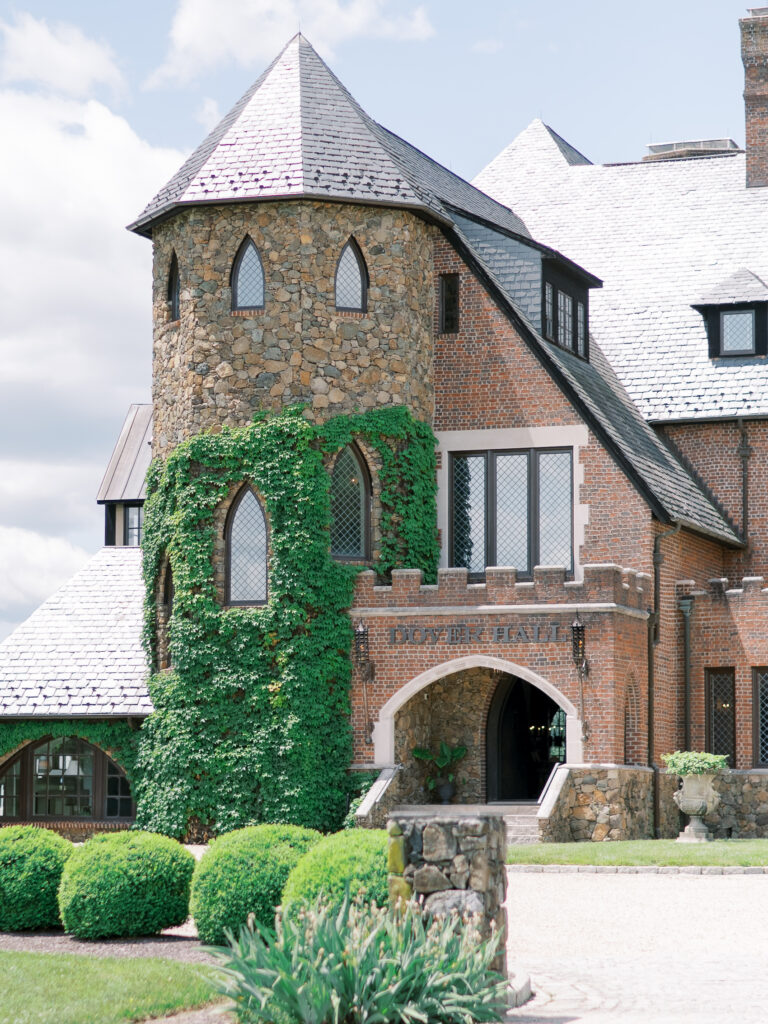 Daytime view of Dover Hall’s stone exterior and manicured grounds, a luxury wedding venue near Richmond, VA.
